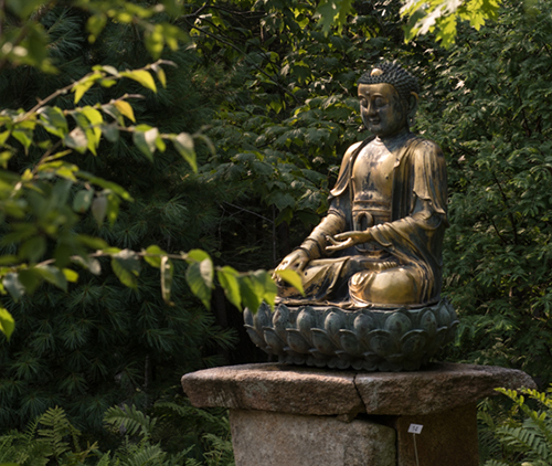 Statue in the woods. Links to What to Give